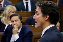 Canada's Prime Minister Justin Trudeau speaks as Conservative Party of Canada leader Pierre Poilievre listens during Question Period in the House of Commons on Parliament Hill in Ottawa, Ontario, Canada September 18, 2023.