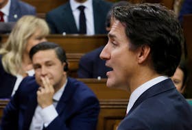 Canada's Prime Minister Justin Trudeau speaks as Conservative Party of Canada leader Pierre Poilievre listens during Question Period in the House of Commons on Parliament Hill in Ottawa, Ontario, Canada September 18, 2023.