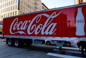 A Coca-Cola truck makes its way through downtown Los Angeles, California, U.S., October 24, 2018.