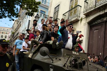Retired members of the military stand inside an original military vehicle of Portugal's Carnation Revolution during the commemorations of the 50th anniversary of Portugal's Carnation Revolution that resulted in the overthrow of dictatorship. Pedro Nunes/Reuters