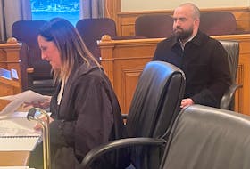Matthew Power sits in Newfoundland and Labrador Supreme Court behind his lawyer, Rosellen Sullivan, Wednesday, Jan. 17, 2024. TARA BRADBURY FILE PHOTO • THE TELEGRAM