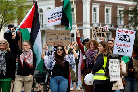 People demonstrate in support of Palestinians, on the day Nicaragua asked the International Court of Justice to order Berlin to halt military arms exports to Israel and reverse its decision to stop funding U.N. Palestinian refugee agency UNRWA, outside the Peace Palace in The Hague, Netherlands, April 8, 2024.
