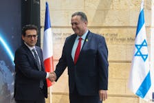 French Foreign Minister Stephane Sejourne shakes hands with his Israeli counterpart Israel Katz, in Jerusalem, April 30, 2024.