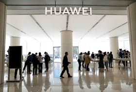 Customers shop at a Huawei's flagship store, as Huawei Pura 70 series models go on sale, in Beijing, China April 18, 2024.
