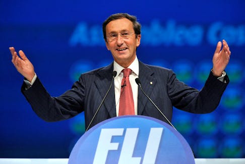 Gianfranco Fini gestures as he delivers his speech at the first meeting of his new political party 'Futuro e Liberta' (Future and Freedom) in Milan, February 13, 2011.   