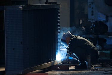 A man works at a factory at the Keihin industrial zone in Kawasaki, Japan February 28, 2017.