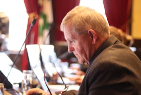 Coun. Trevor MacKinnon listens to debate at the April. 9 Charlottetown council meeting. Logan MacLean • The Guardian