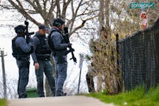 Members of the Halifax regional police emergency response team are seen in front of a home on Gaston Road in Dartmouth Tuesday, April 30, 2024.

TIM KROCHAK PHOTO