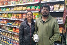 Sugumar Krishnan  shop for frozen fish and fresh produce from the store