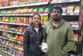 Sugumar Krishnan  shop for frozen fish and fresh produce from the store