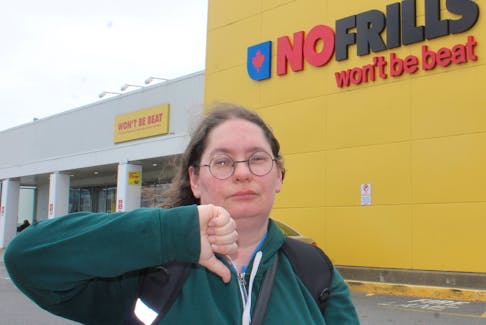 Mandy Ardelli of Sydney gives her disapproval of Loblaw Cos. Ltd. current high prices on Tuesday outside a No Frills on Welton Street in Sydney: "Many people were already boycotting (Loblaw-owned stores) simply because they can't afford it, but some people now have no choice." IAN NATHANSON/CAPE BRETON POST