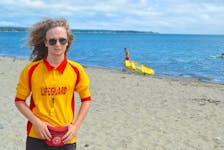 Lifeguard Bennett MacIntyre is seen at Mira Gut beach in this 2022 file photo. After struggling the past few years to hire enough lifeguards to patrol the province’s beaches, Lifesaving Society of Nova Scotia special projects director Paul D’Eon says the situation has improved this year. Chris Connors/Cape Breton Post