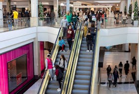 People ride on the elevator as shoppers show up early for the Black Friday sales at the King of Prussia shopping mall in King of Prussia, Pennsylvania, U.S. November 26, 2021. 