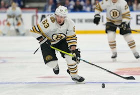 Boston Bruins forward Brad Marchand carries the puck against the Toronto Maple Leafs during an NHL playoff game at Scotiabank Arena in Toronto. - John E. Sokolowski-USA TODAY Sports