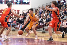 Lance Howlett, centre, dribbles the ball as River Lanz, left, and Lance Mombourquette play defence during last year's Steele All Atlantic game at Saint Mary's University. - Contributed/All Atlantic Game