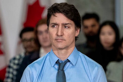 Prime Minister Justin Trudeau listens to a speaker during a housing announcement in Vancouver, Wednesday, March 27, 2024.