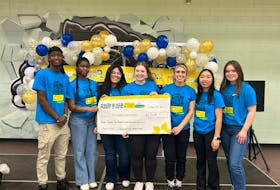 Simba Hove, left, Eyitayo Ajibaibi, Luciana Quiroa Paredes, Katelyn Maccaull, Hannah Bertrand, Emily Chong and Sophie Blades display the amount raised at the Relay For Life closing ceremony – $13,350 for cancer research for the Canadian Cancer Society. Contributed