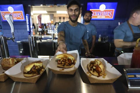 The Toronto Blue Jays unveiled Phase 1 of their renovations at Rogers Centre with an open house on April 6, 2023, in Toronto, which included poutine hotdogs served up in the Outfield District. This year's new food offerings include Hot Honey Maple Bacon Dogs and jerk chicken-stuffed Jamaican patties.