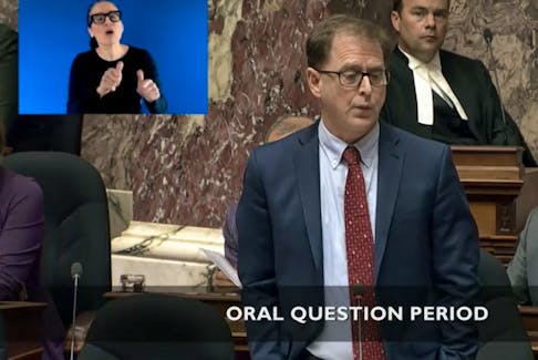B.C. health minister Adrian Dix rises in the B.C. Legislative Assembly to respond to a leaked memo in which hospital workers were told not to confiscate weapons or illicit drugs from patients. 