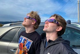 Sun spotters  
   Judah Janes (left) and Brody Chatman of Labrador City watch the solar eclipse from the Corner Brook Plaza parking lot in Corner Brook on Monday, April 8. Diane Crocker • SaltWire