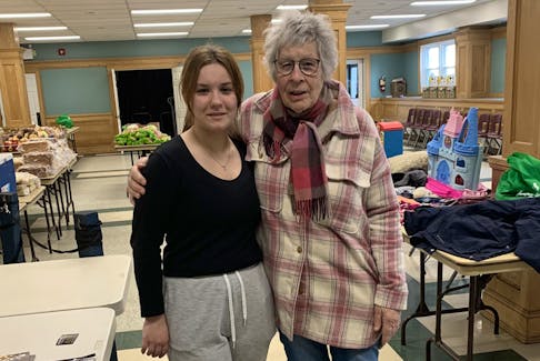 Christine Hoehne, right, volunteer co-ordinator at the Christ Church food bank in Dartmouth, with volunteer Arina Perederii.