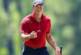 Tiger Woods of the United States acknowledges the crowd while walking to the 18th green during the final round of the 2024 Masters Tournament at Augusta National Golf Club on Sunday, April 14, 2024 in Augusta, Georgia.