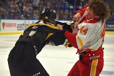 Cam Squires of the Cape Breton Eagles, left, and Alexis Bernier of the Baie-Comeau Drakkar drop the gloves during the first period of Game 4 of the Quebec Maritimes Junior Hockey League semifinal series at Centre 200 in Sydney on Tuesday. Baie-Comeau won the game 8-2. JEREMY FRASER/CAPE BRETON POST