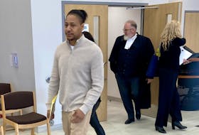 Tyreece Alexander Whynder-Ewing, left, leaves Nova Scotia Supreme Court in Dartmouth on Wednesday with lawyer Chris Avery after a jury was selected for his trial on a charge of second-degree murder.