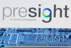 Presight AI logo is seen near computer motherboard in this illustration taken January 8, 2024.