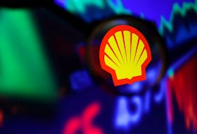 Shell logo and stock graph are seen through a magnifier displayed in this illustration taken September 4, 2022.