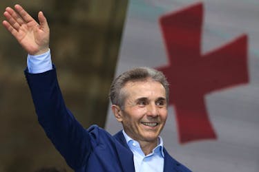Bidzina Ivanishvili, former prime minister and founder of the Georgian Dream party, waves during a pro-government rally in support of a bill on "foreign agents" in Tbilisi, Georgia April 29, 2024.