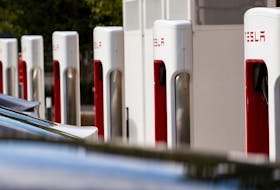Tesla cars are seen next to the V3 supercharger equipment during the presentation of the new charge system in the EUREF campus in Berlin, Germany September 10, 2020.