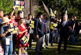 Republican Arizona state Senator Anthony Kern speaks with anti-abortion protesters at the Arizona State Capitol in Phoenix, Arizona, U.S. April 24, 2024.