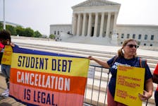Supporters of U.S. President Joe Biden's plan to cancel $430 billion in student loan debt react outside the U.S. Supreme Court, after the court ruled against Biden in a 6-3 decision favoring six conservative-leaning states that objected to the policy, in Washington, U.S. June 30, 2023.  REUTERS/Jim Bourg/File Photo