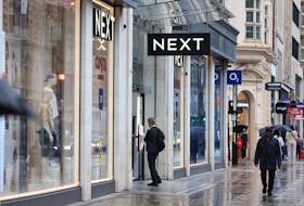 A shopper enters a Next store on Oxford Street in London, Britain, July 31, 2023.