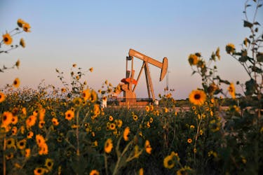 A pump jack operates at a well site leased by Devon Energy Production Company near Guthrie, Oklahoma September 15, 2015.   