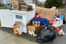 Heavy garbage is seen ready for pickup in New Waterford. Cape Breton Regional Municipality has said heavy garbage pickup will begin Monday, May 6. Prior to that some people collect reusable, repairable and working items from others' curbside trash piles. BARB SWEET/CAPE BRETON POST