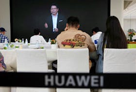 Richard Yu of Huawei Consumer Business Group is seen on a screen during the livestreaming of a Huawei launch event at a Huawei flagship store in Beijing, China, Sept. 25, 2023.