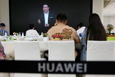 Richard Yu of Huawei Consumer Business Group is seen on a screen during the livestreaming of a Huawei launch event at a Huawei flagship store in Beijing, China, Sept. 25, 2023.