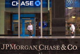 A customer exits the lobby of JPMorgan Chase & Co. headquarters in New York May 14, 2012.