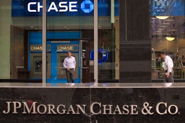 A customer exits the lobby of JPMorgan Chase & Co. headquarters in New York May 14, 2012.