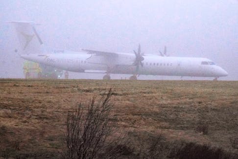 A PAL Airlines Dash 8-Q400 aircraft sits at the end of Runway 10 at St. John's International Airport Wednesday, May 1, 2024 after overrunning the end of the runway on landing. No injuries to passengers or crew reported. The Transportation Safety Board of Canada is investigating. — Photo courtesy of Gary Hebbard