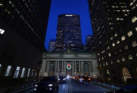 Vehicles drive in front of the MetLife Inc. building in Manhattan, New York, U.S., December 7, 2021.