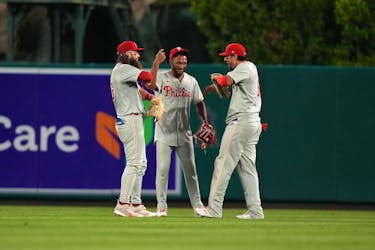 Apr 30, 2024; Anaheim, California, USA; Philadelphia Phillies outfielder Brandon Marsh (16), center fielder Johan Rojas (18) and right fielder Nick Castellanos (8) celebrate after the game against the Los Angeles Angels at Angel Stadium. Mandatory Credit: Kirby Lee-USA TODAY Sports