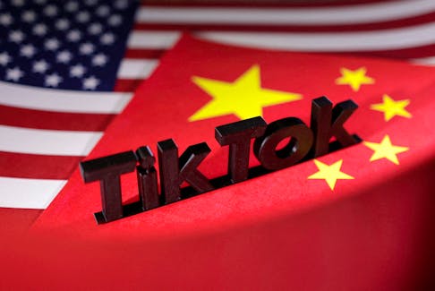 TikTok logo is placed on the U.S. and Chinese flags in this illustration taken, April 25, 2024.