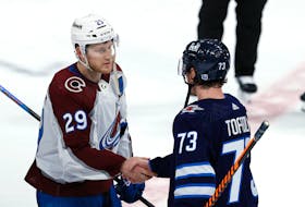 Colorado Avalanche centre Nathan MacKinnon (29) shakes hands with Winnipeg Jets centre Tyler Toffoli (73) after Game 5 of the first round of the 2024 Stanley Cup playoffs at Canada Life Centre in Winnipeg. - James Carey Lauder-USA TODAY Sports
