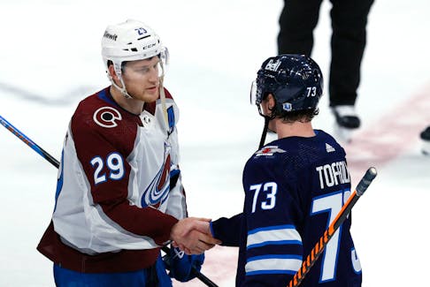 Colorado Avalanche centre Nathan MacKinnon (29) shakes hands with Winnipeg Jets centre Tyler Toffoli (73) after Game 5 of the first round of the 2024 Stanley Cup playoffs at Canada Life Centre in Winnipeg. - James Carey Lauder-USA TODAY Sports