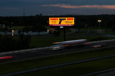 A digital advertisement for the Tampa Gun Show sits along a highway in Tampa, Florida, U.S., October 9, 2023. 