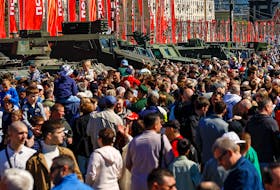 People visit an exhibition, which displays armoured vehicles and equipment captured by the Russian army from Ukrainian forces in the course of Russia-Ukraine conflict, at Victory Park open-air museum on Poklonnaya Gora in Moscow, Russia, May 1, 2024.