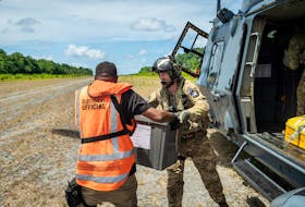 Members of the New Zealand Defence Force (NZDF) Joint Task Force assist in delivering ballot boxes by NH90 helicopter to remote areas of the Solomon Islands, April 17, 2024. New Zealand Defence Force/Handout via REUTERS